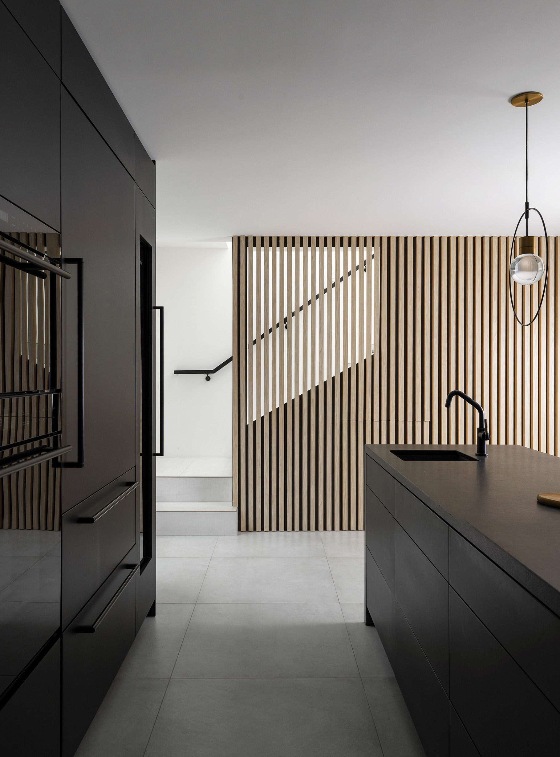 Kitchen feature wall and stairwell
