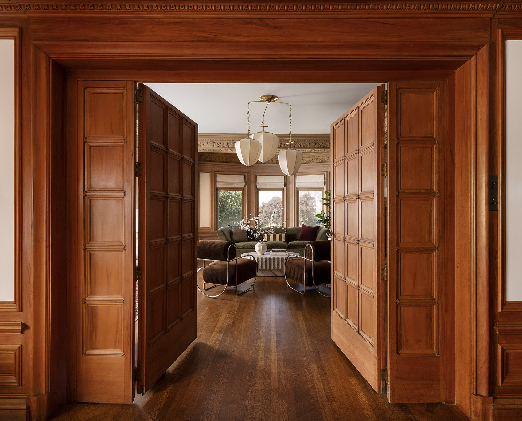 Living room seen through the Venetian entryway doors