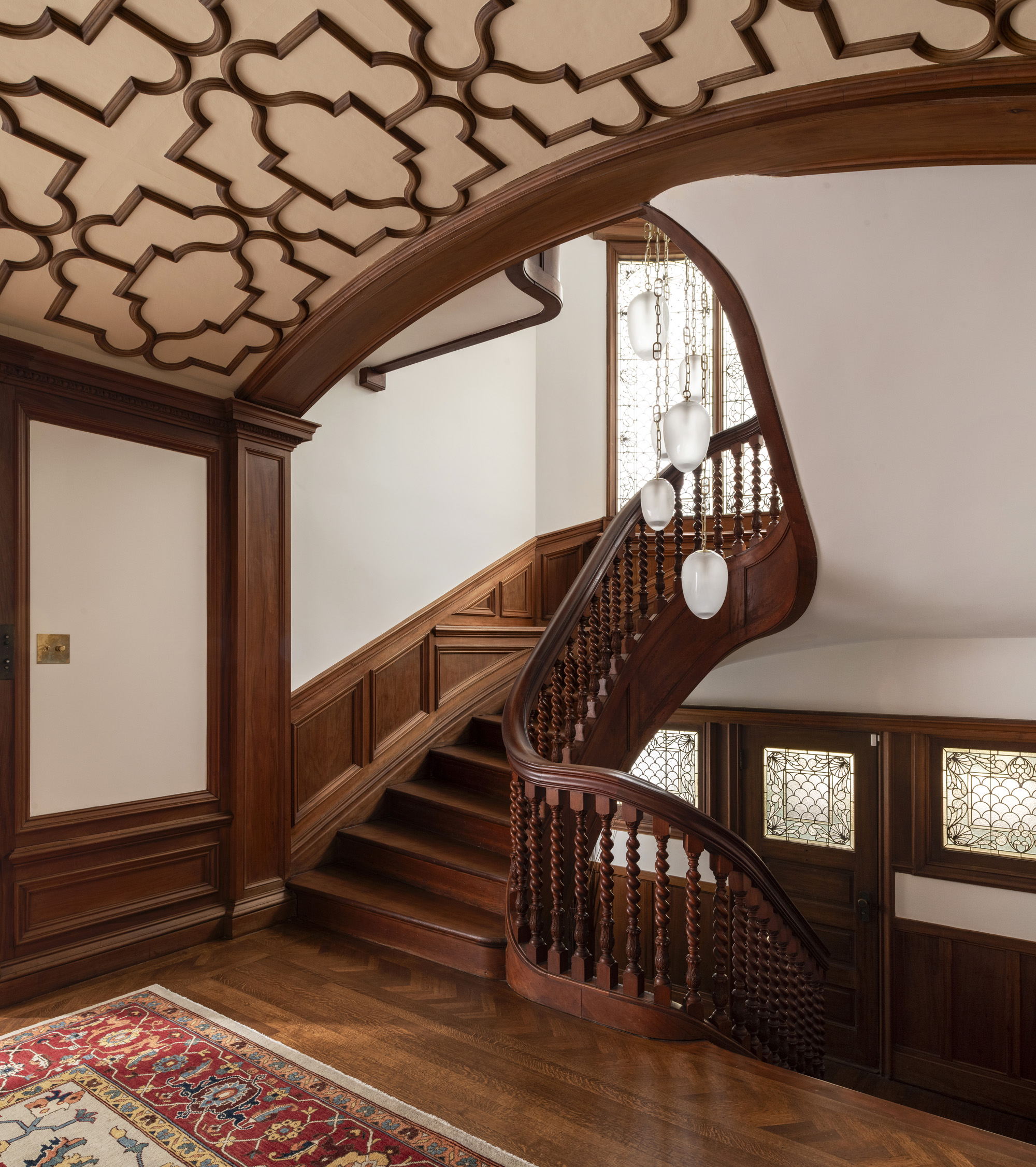 Foyer stairwell beneath the restored arched ceiling