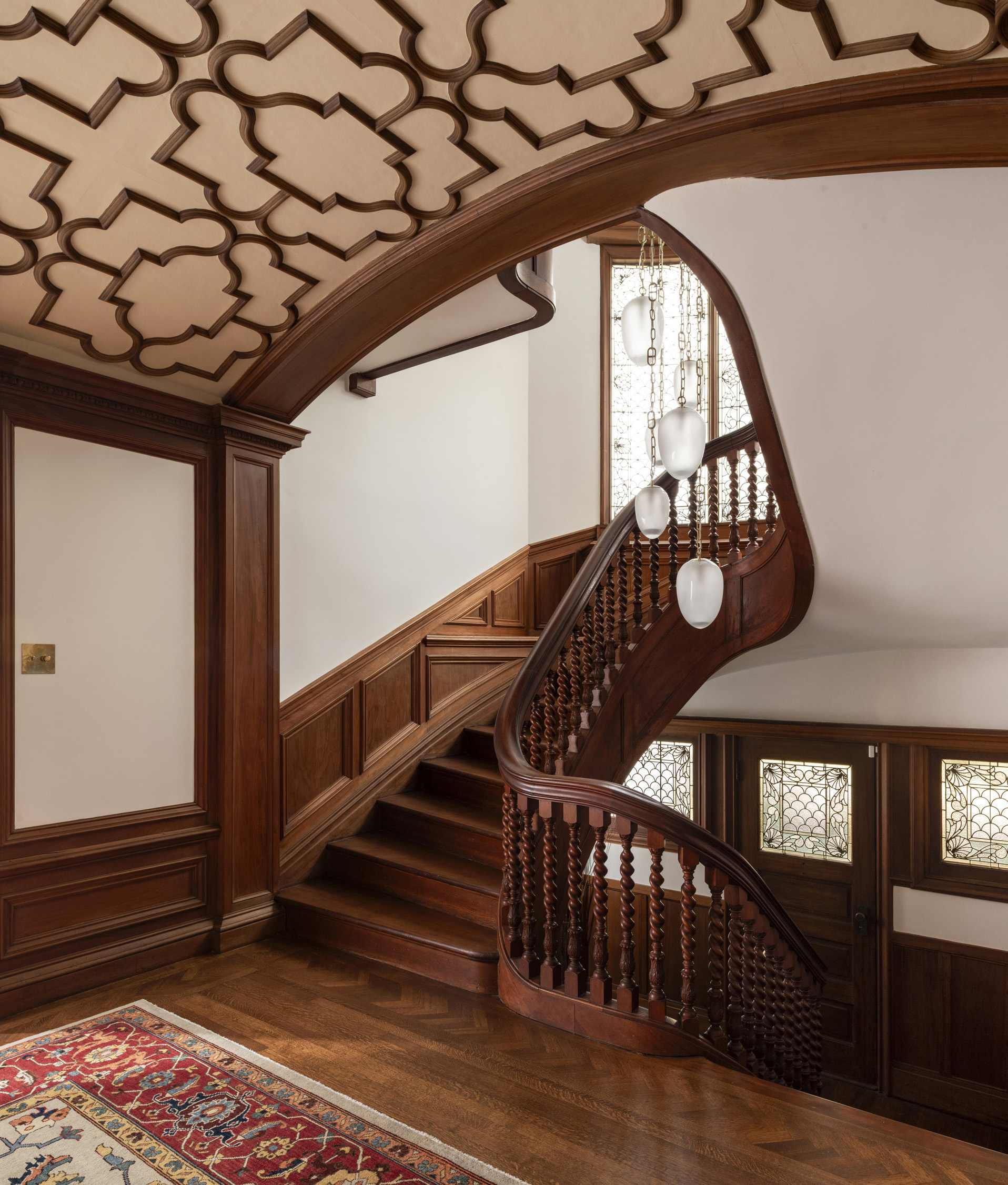 Classic Victorian architecture - carved wooden spiral stairwell - architectural photography by Philippe Newman