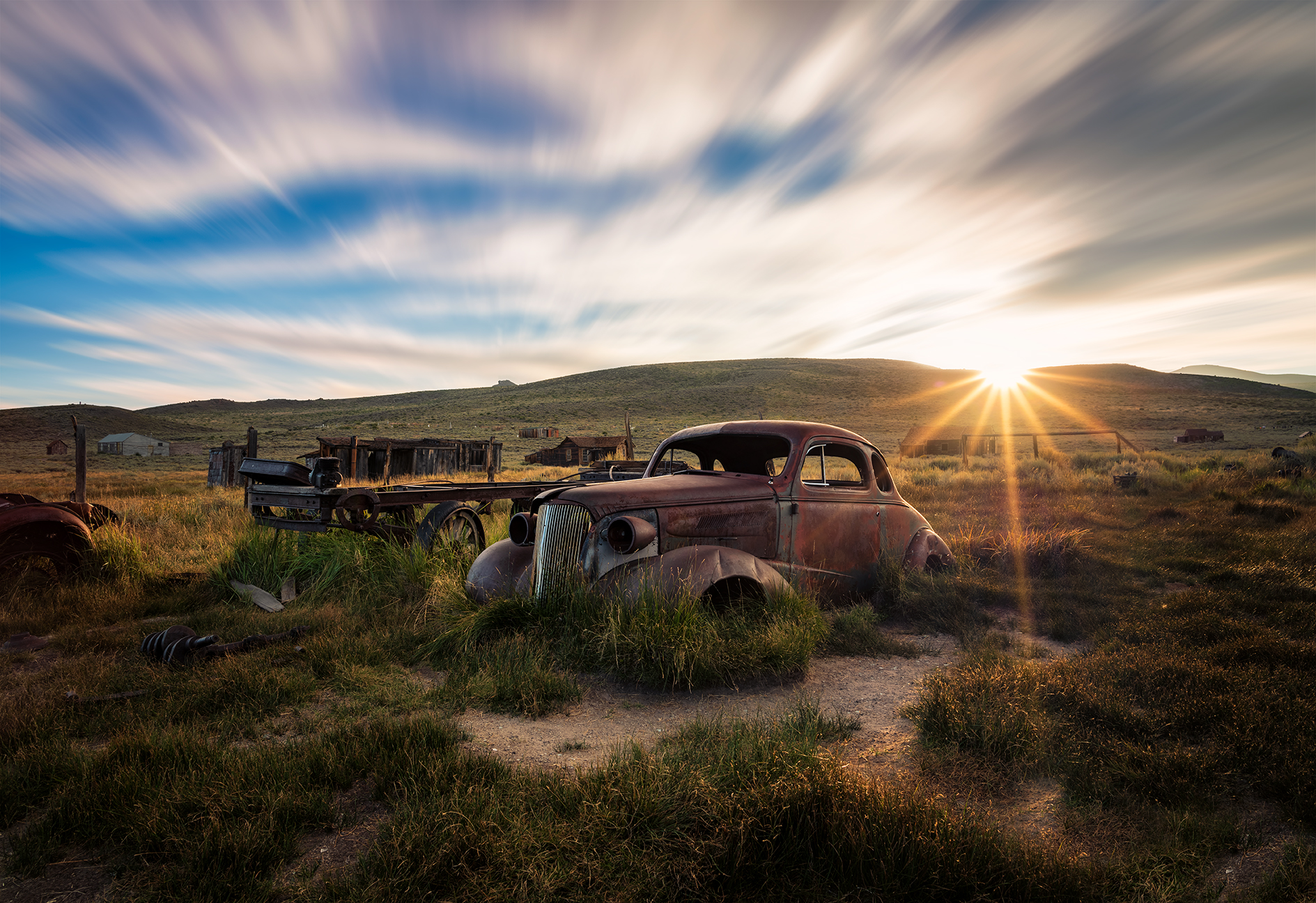 sunset photography of an old abandoned Chevy in the hills near Mono Lake, California