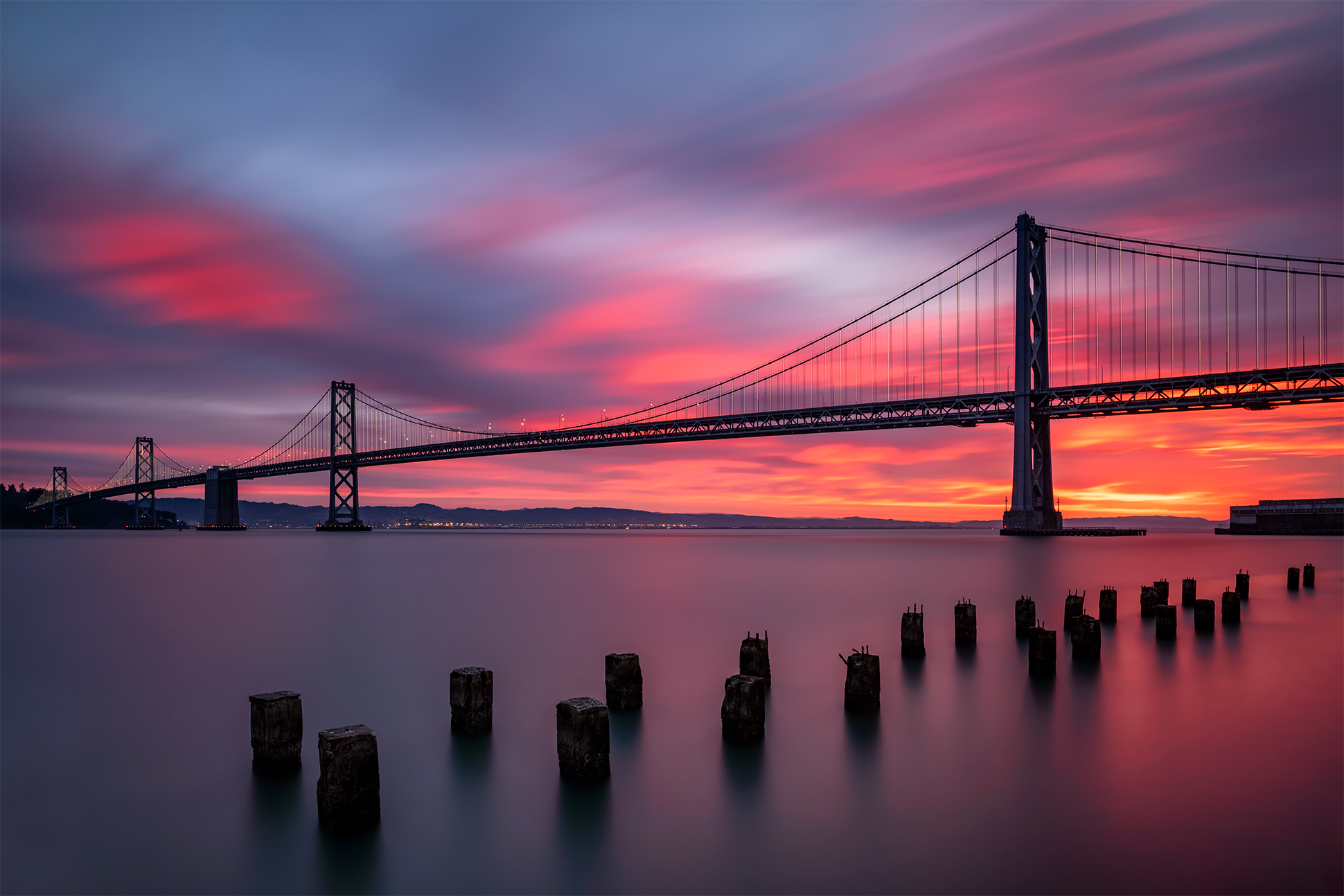 Beautiful sunrise long exposure of the Bay Bridge from the San Francisco Embarcadero